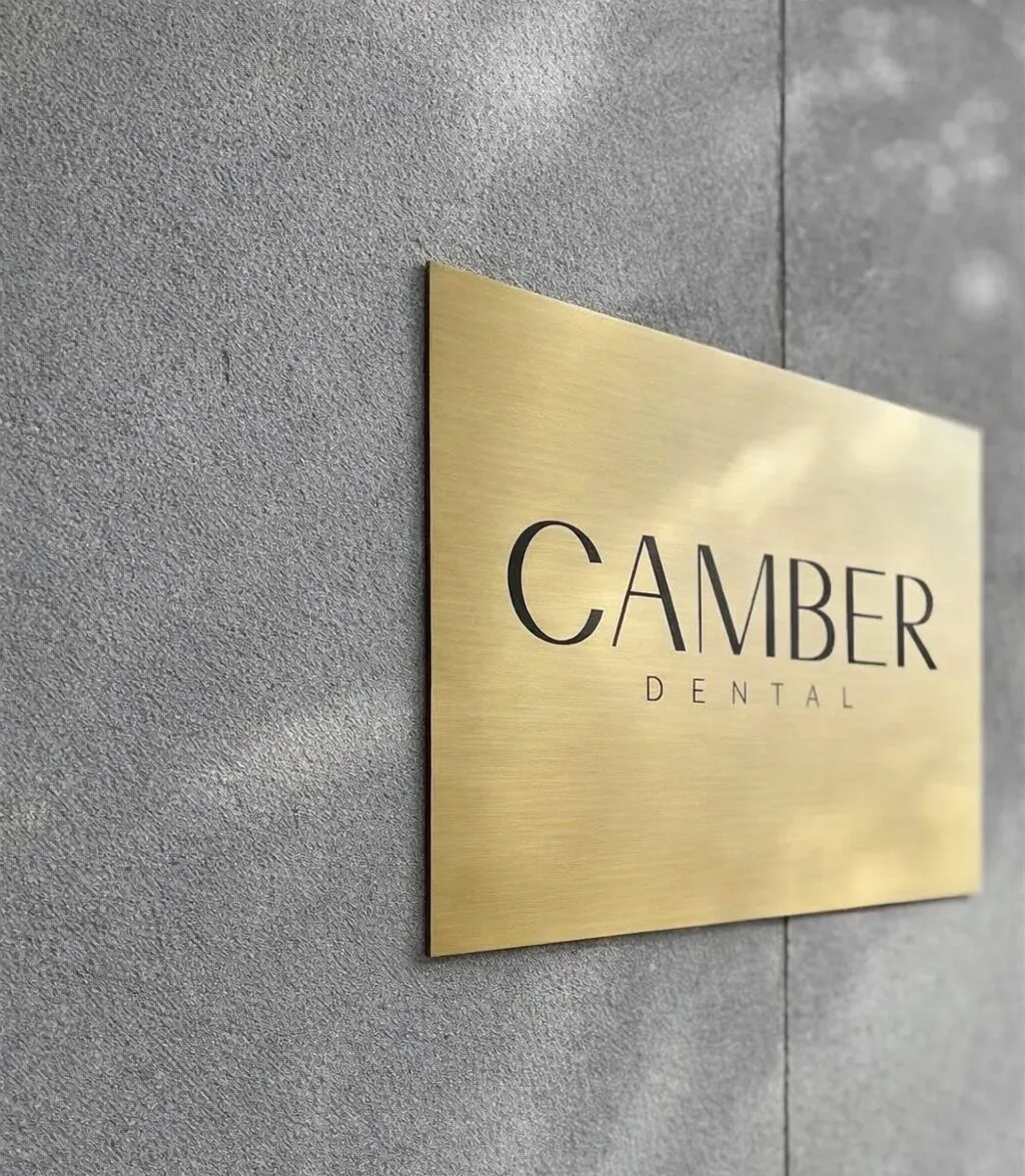 Camber Dental brass entrance plaque